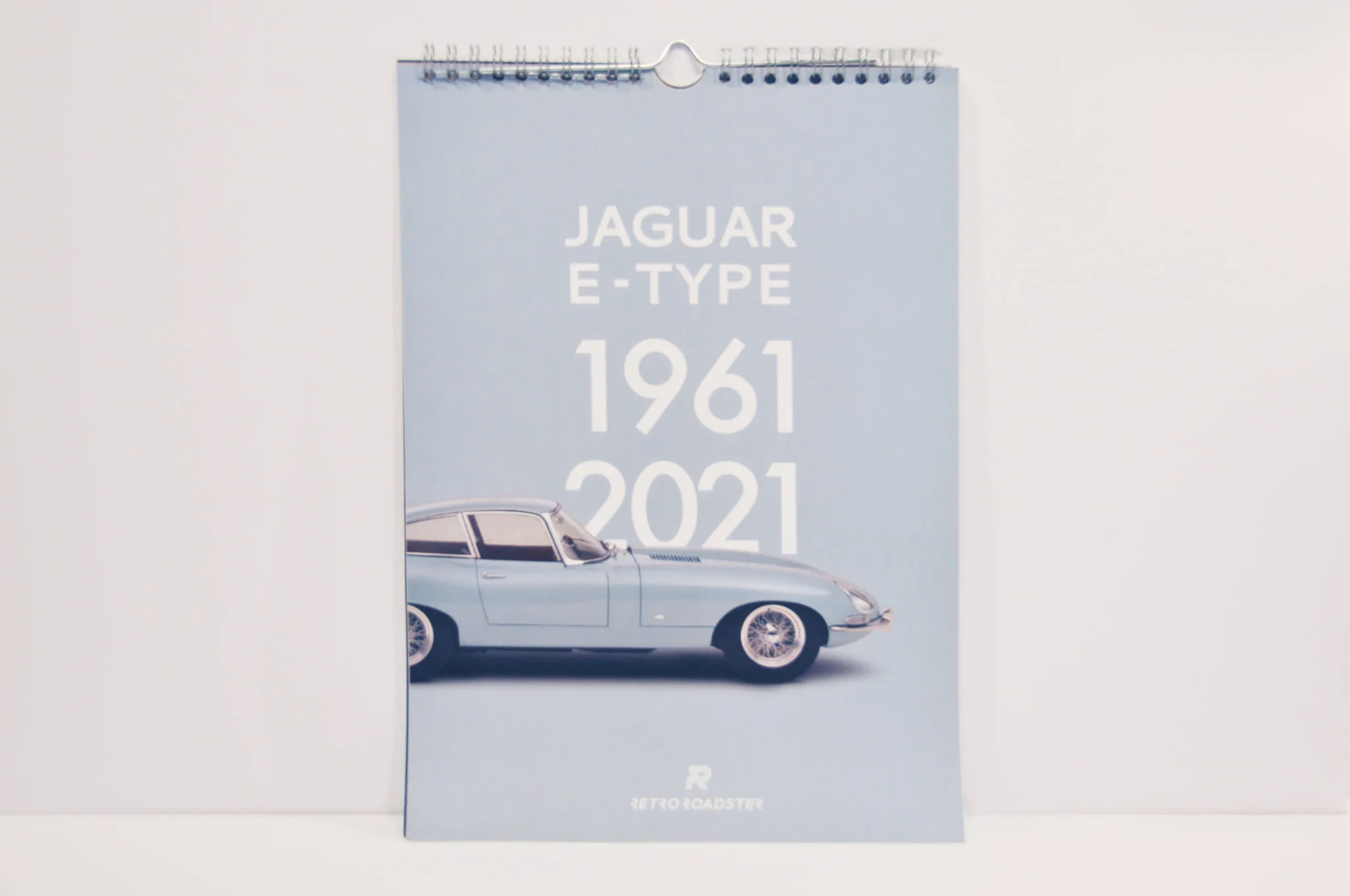 Jaguar E-Type calendar photographed open with historic car imagery