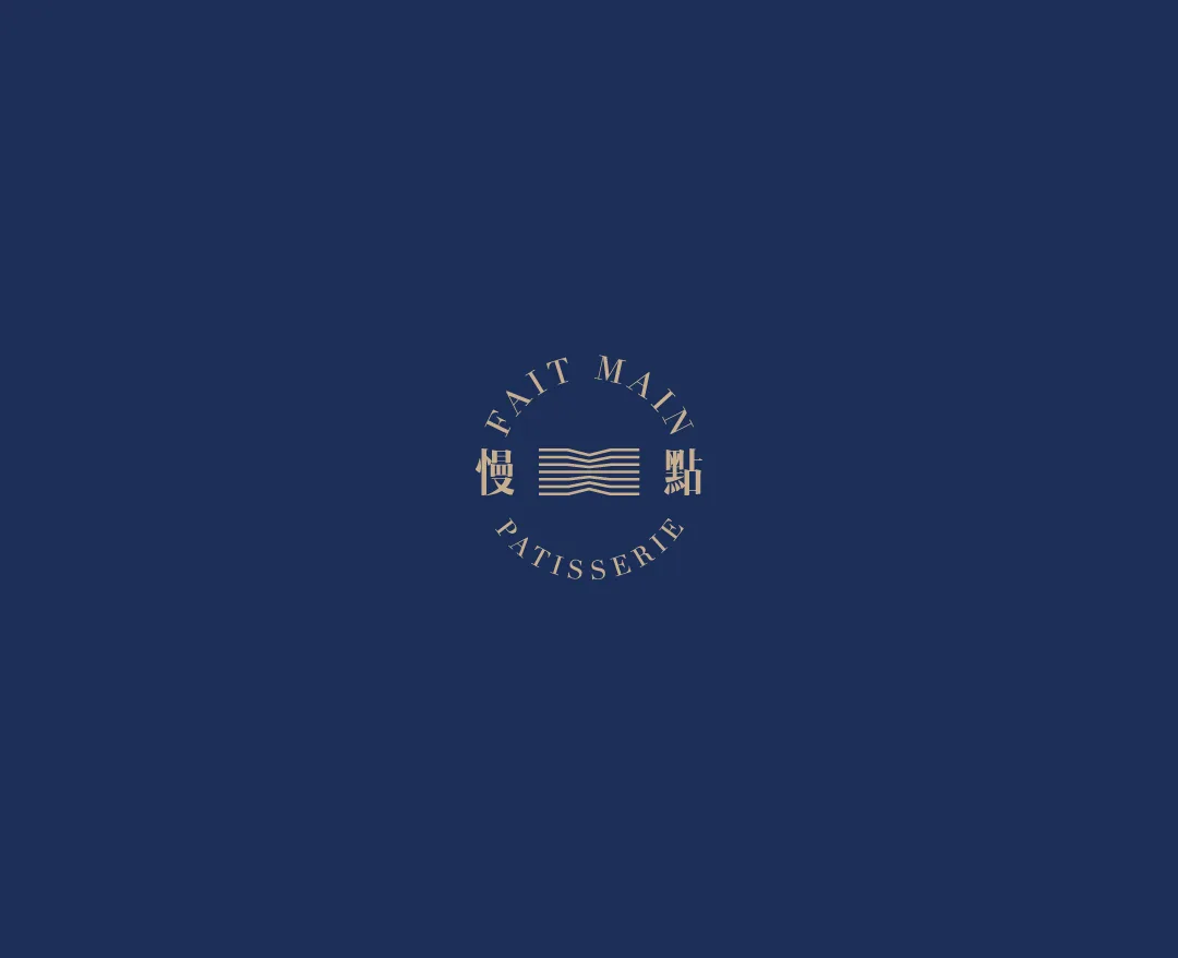 Fait Main Pâtisserie identity mark in gold on a deep blue menu cover